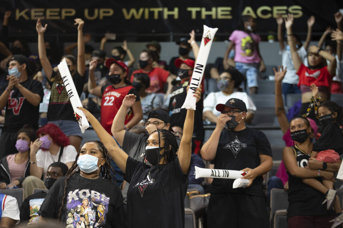 Las Vegas Aces fans cheer for their team during the second half of a WNBA game against the Minn ...