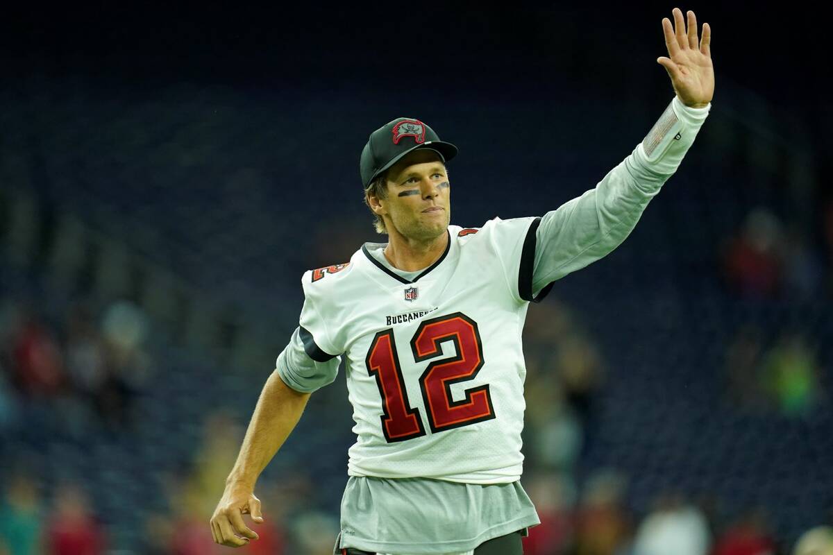 Tampa Bay Buccaneers quarterback Tom Brady (12) waves toward the fans as he leaves the field af ...