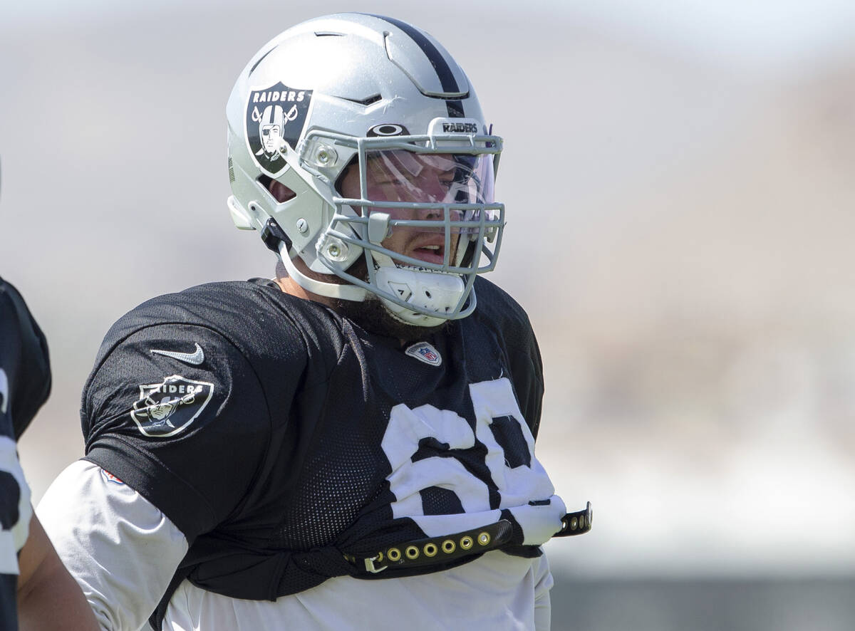 Raiders centers Nick Martin (66) and Andre James (68) look on during team practice at the Raide ...