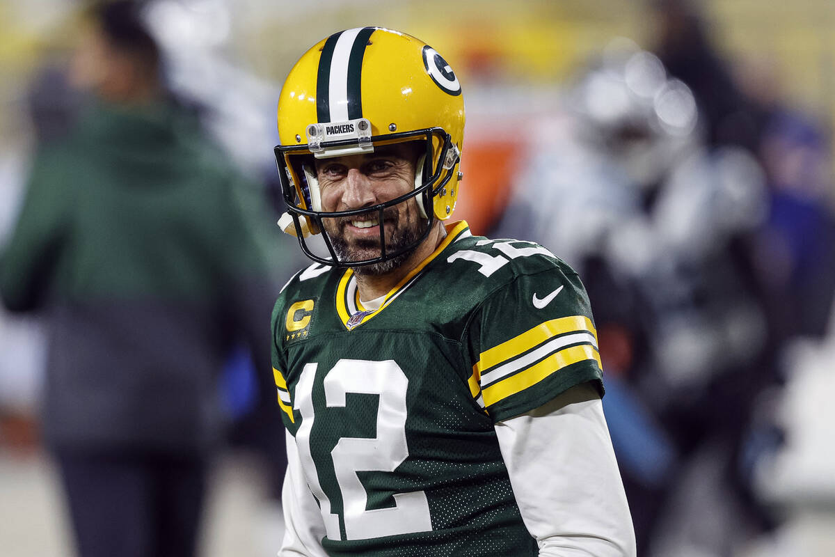 FILE - In this Dec 19. 2020, file photo, Green Bay Packers quarterback Aaron Rodgers (12) smile ...