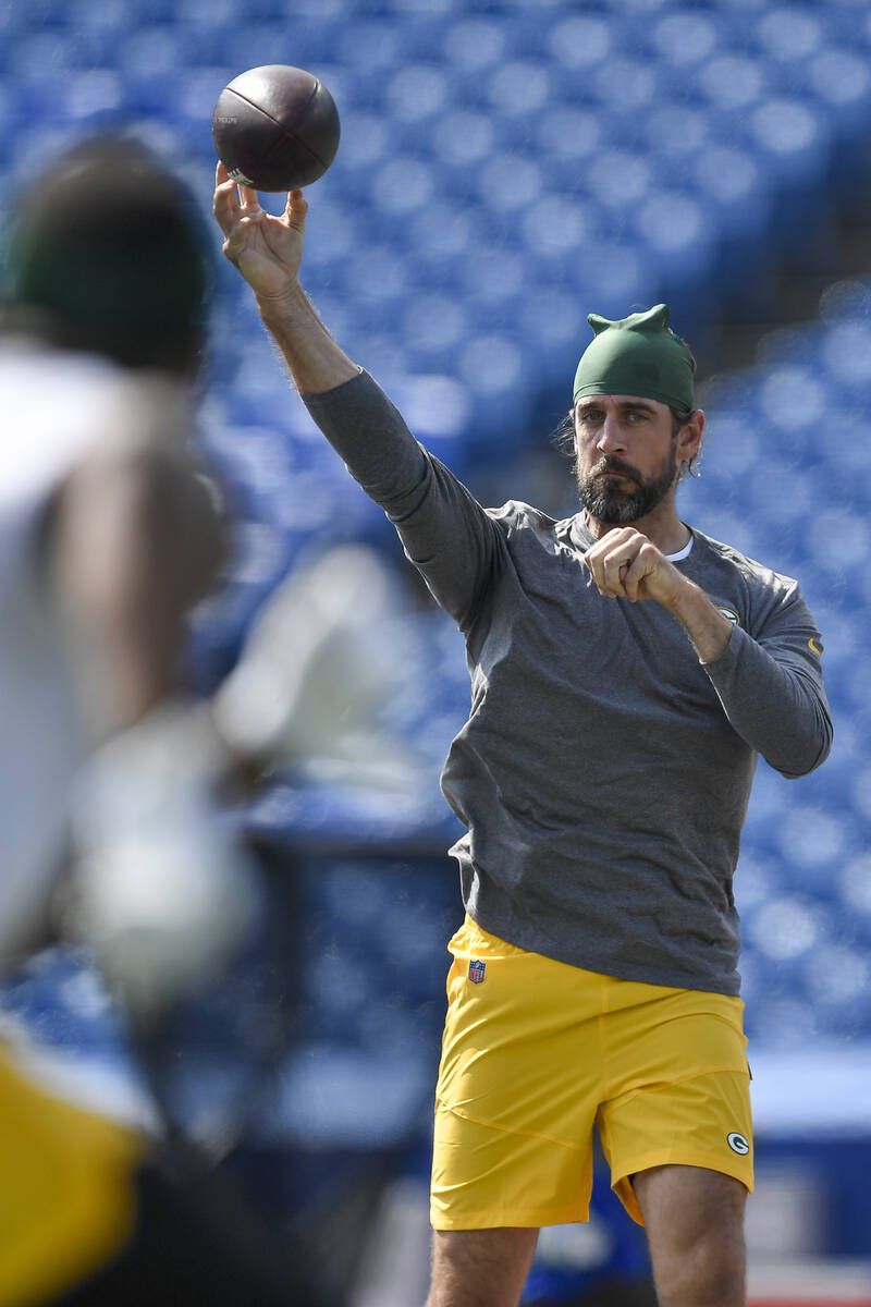 Green Bay Packers quarterback Aaron Rodgers warms up before a preseason NFL football game again ...