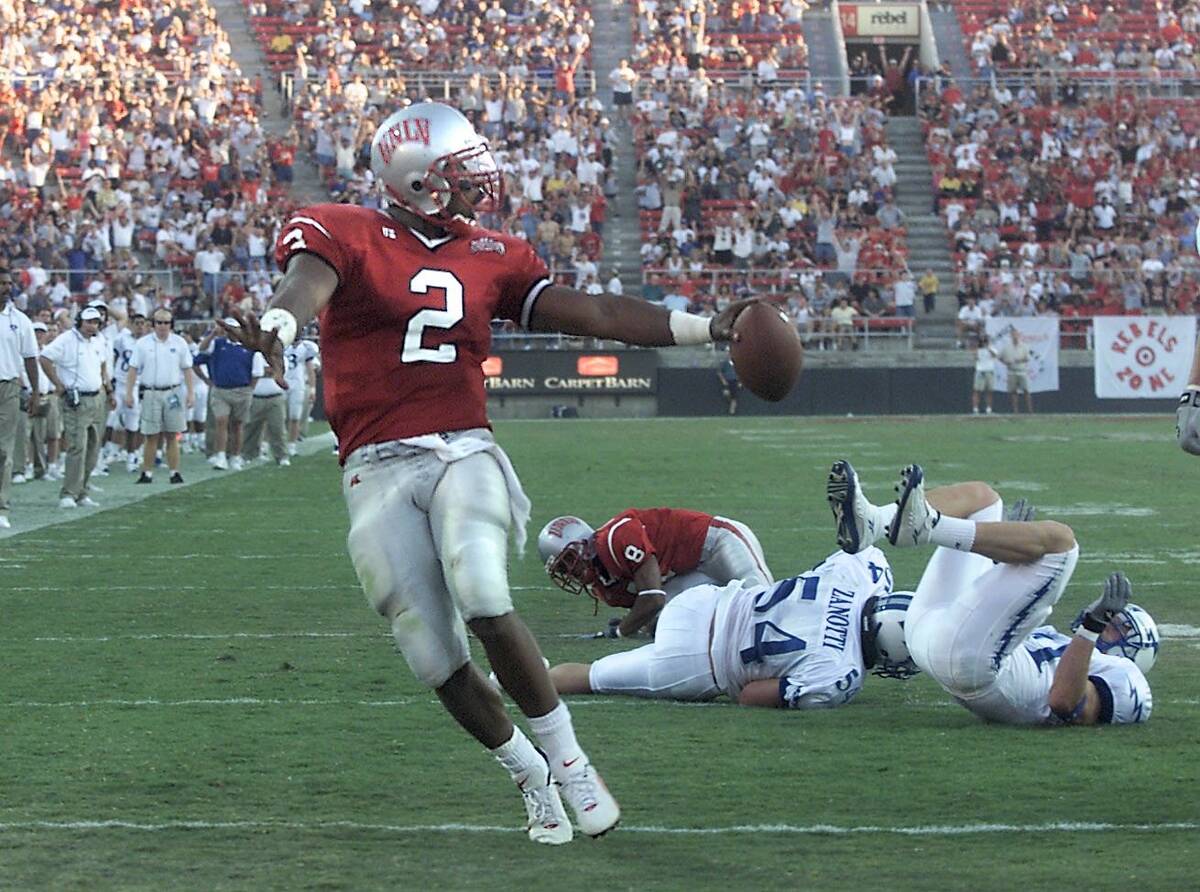 Sports;09-30-00, UNLV quarterback Jason Thomas runs into the end zone for a touchdown against ...