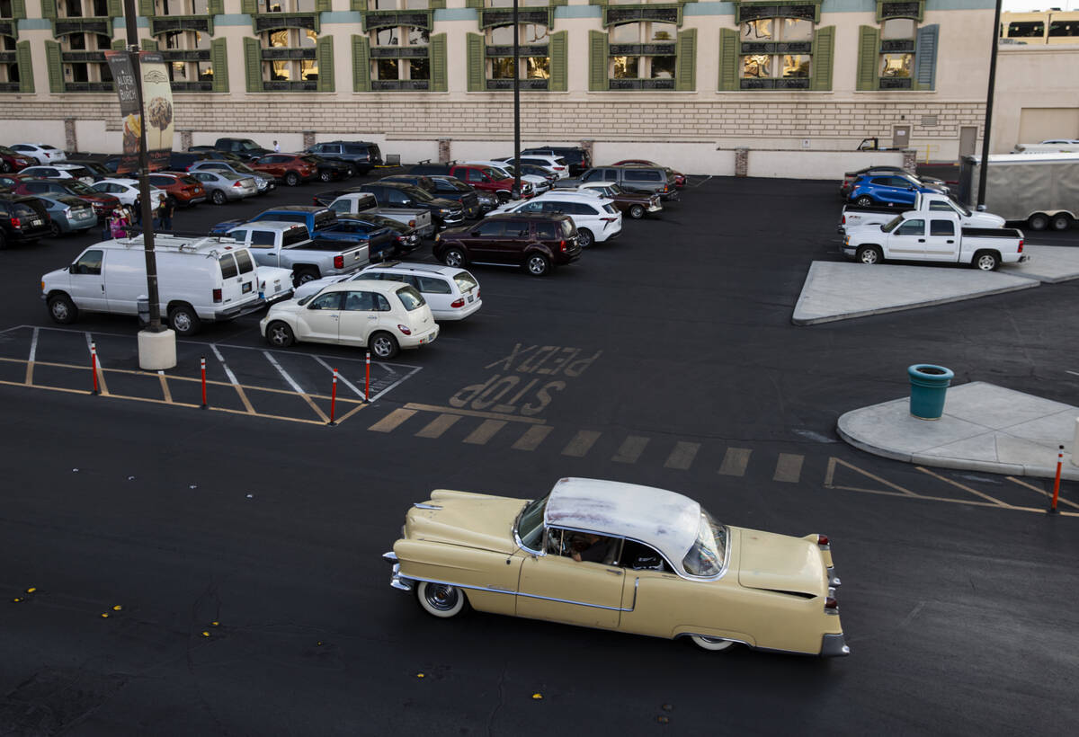 A 1955 Cadillac Coupe DeVille passes by on the first day of Viva Las Vegas Rockabilly Weekend a ...