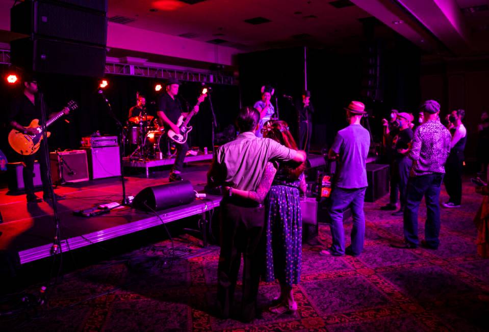 Attendees watch as Las Vegas band Shanda & the Howlers perform during the first day of Viva ...