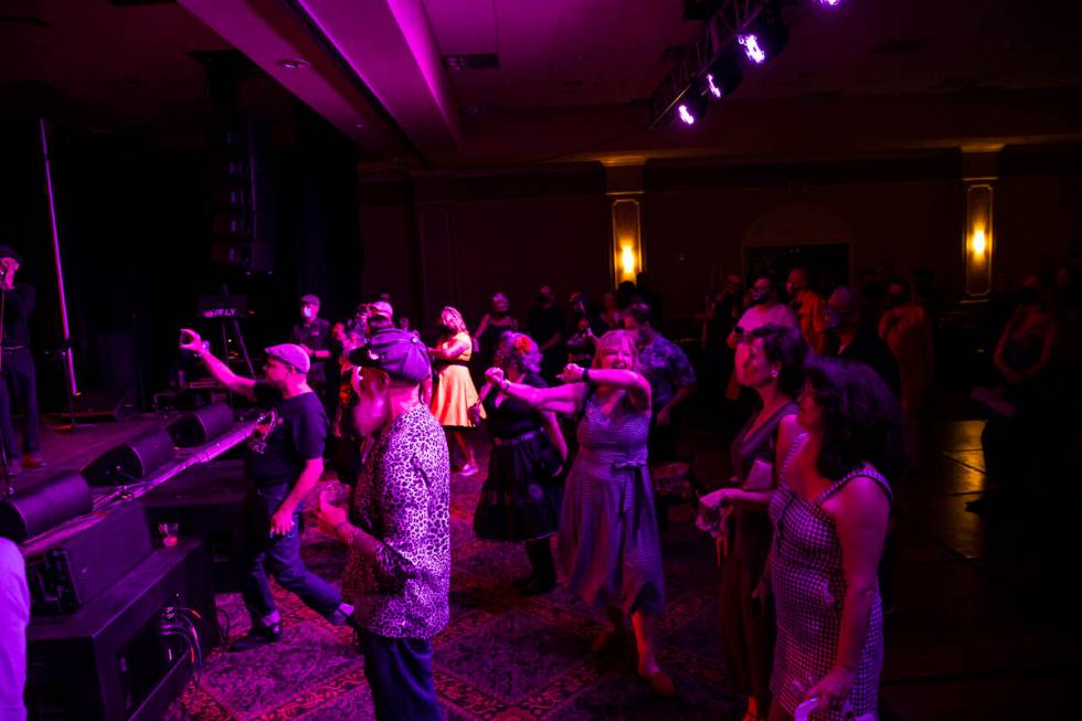 Attendees dance as Las Vegas band Shanda & the Howlers perform during the first day of Viva ...