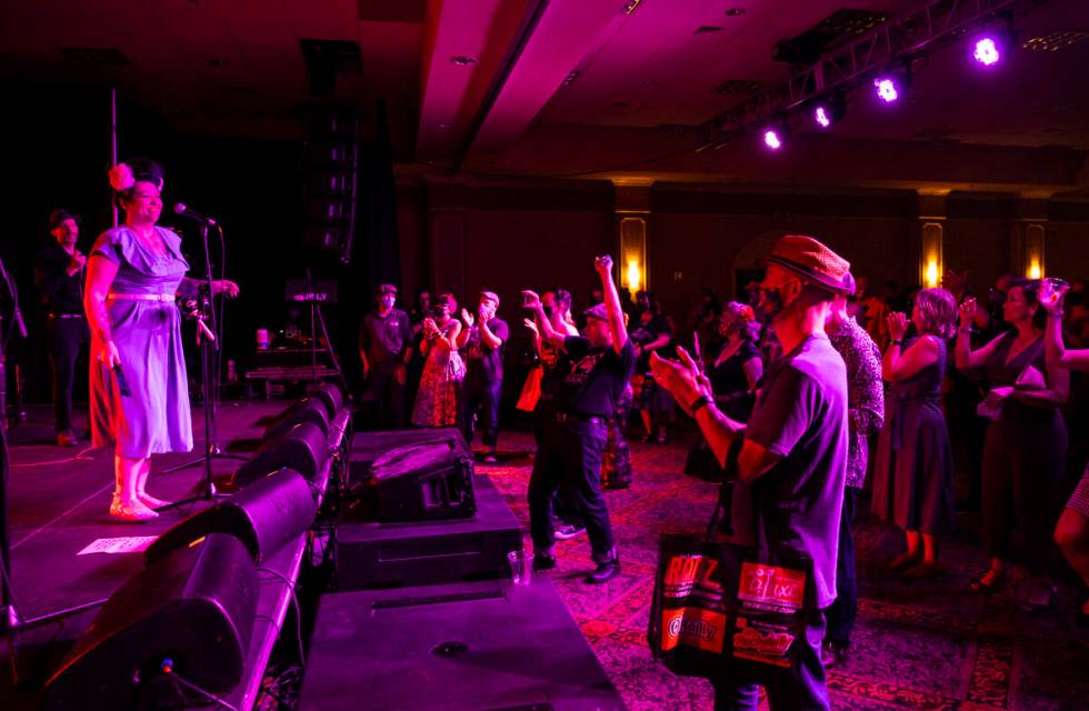 Attendees cheer as Las Vegas band Shanda & the Howlers perform during the first day of Viva ...