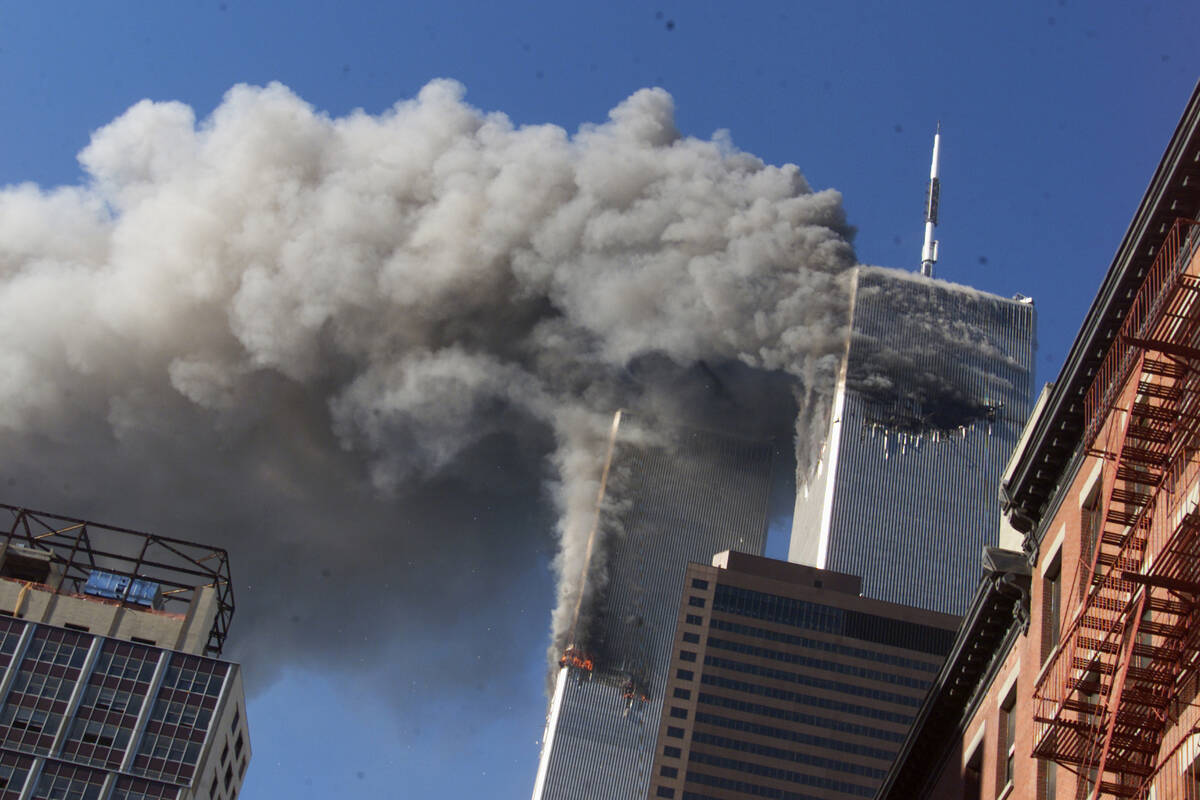 In this Sept. 11, 2001, file photo, smoke rises from the burning twin towers of the World Trade ...