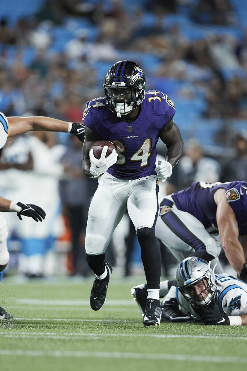 Baltimore Ravens running back Ty'Son Williams (34) runs with the football during an NFL preseas ...