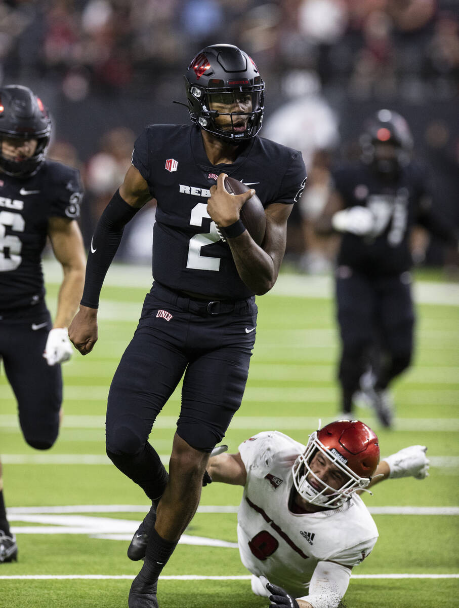 UNLV Rebels quarterback Doug Brumfield (2) goes for a touchdown during the fourth quarter of an ...
