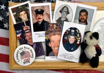 Memorial mass cards with photographs of fallen firefighters, collected from New York-New York's ...