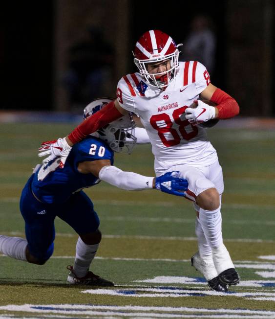 Liberty safety Saco Alofipo (20) tries to take down Mater Dei wide receiver Jack Ressler (88) o ...