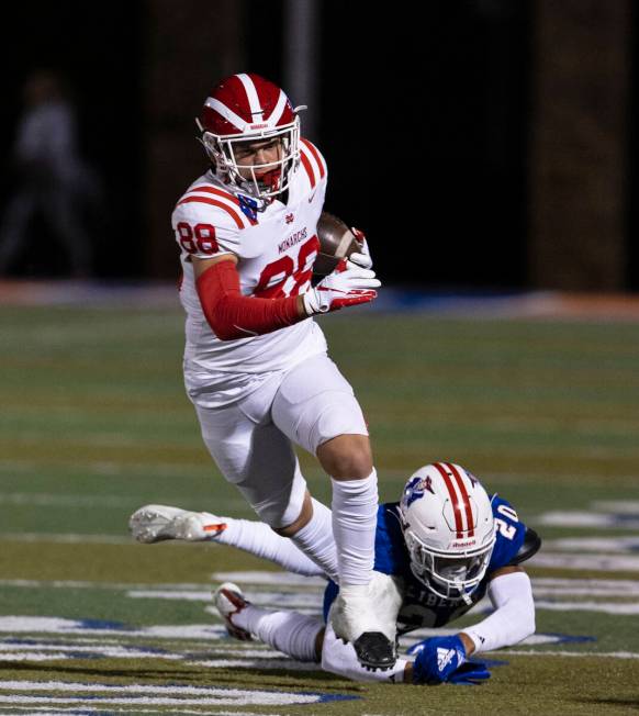 Liberty safety Saco Alofipo (20) tries to take down Mater Dei wide receiver Jack Ressler (88) o ...