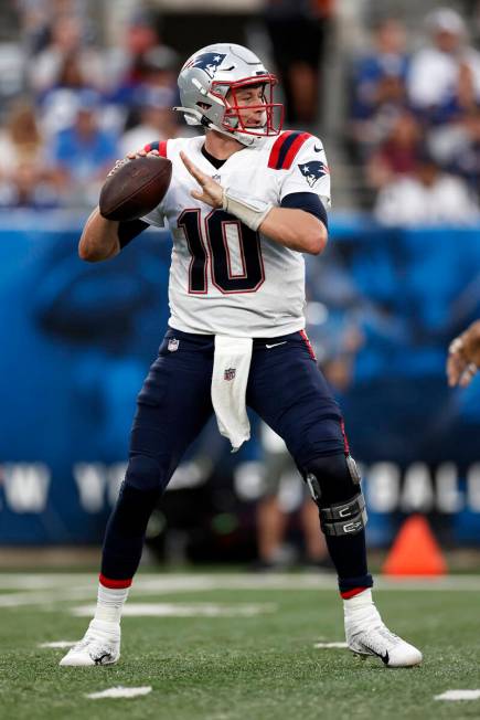 New England Patriots quarterback Mac Jones (10) in action against the New York Giants during an ...
