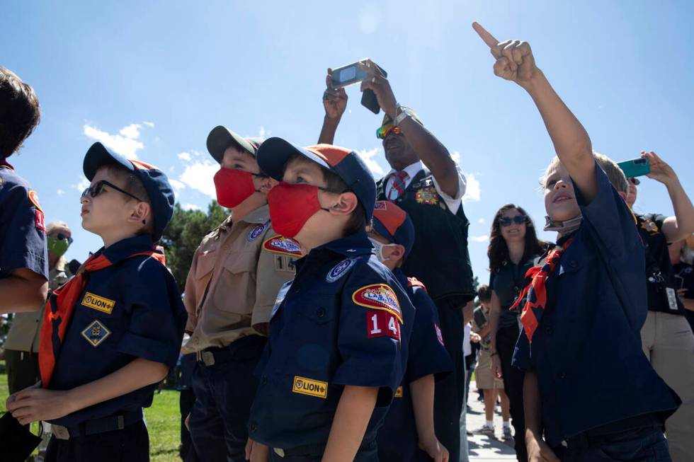 A group of Boy Scouts watches as balloons are released in honor of first responders who died in ...