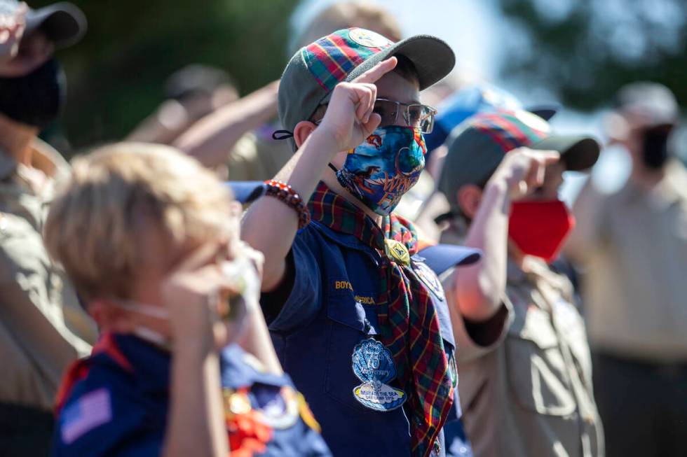 A group of Boy Scouts salutes as the national anthem is sung during a Sept. 11 remembrance even ...