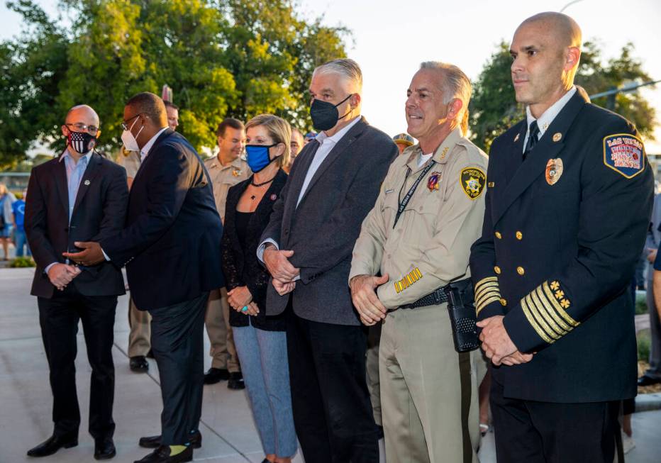 Officials and guests stand, Saturday, Sept. 11, 2021, at Fire Station Five in Las Vegas, during ...