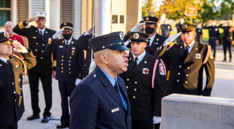 Retired New York City firefighter Frank Pizarro sings the national anthem, Saturday, Sept. 11, ...