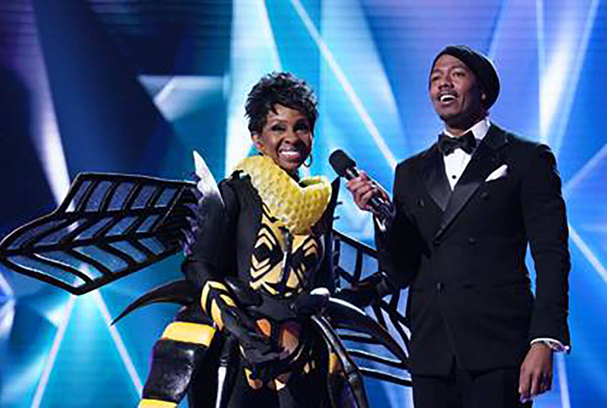 The Bee is revealed as Gladys Knight during "The Masked Singer." With Knight is host Nick Cann ...