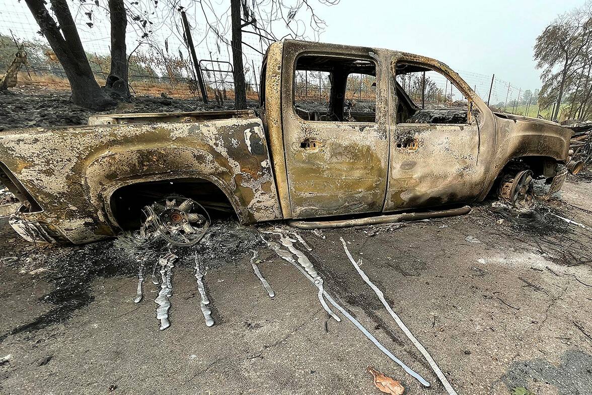 The melted metal from a pickup truck's rims ran down the driveway of this Chicago Park, Calif., ...