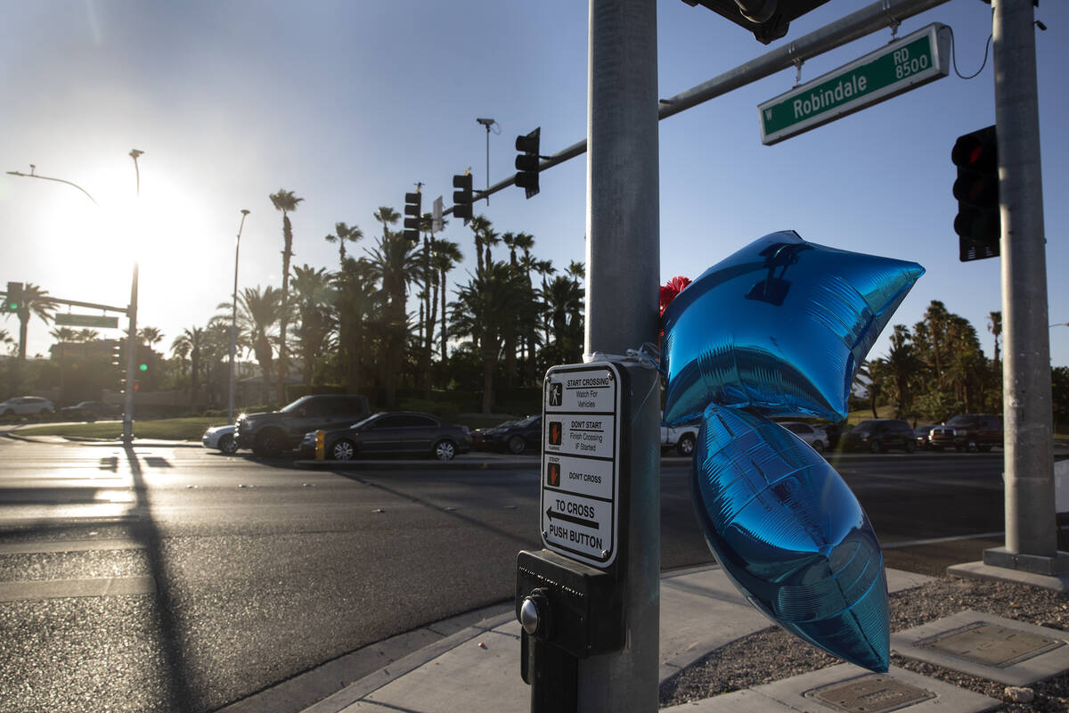 A memorial with balloons and flowers is seen at intersection of West Robindale Road and South D ...