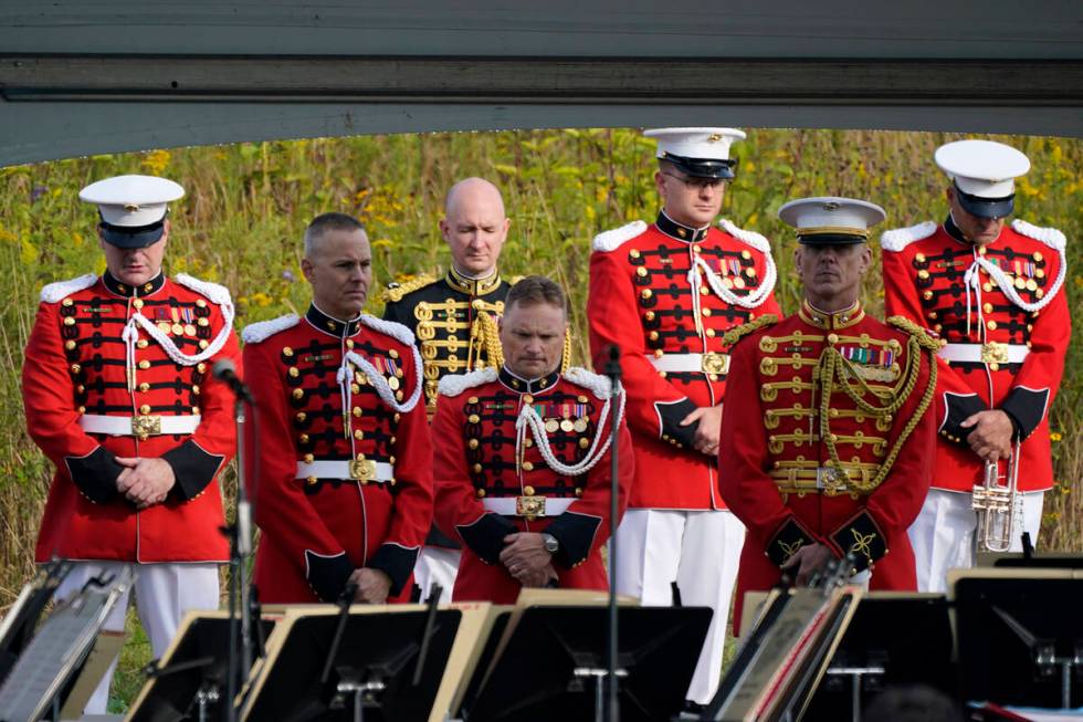 Members of the United States Marine Band observe a moment of silence before performing at the F ...