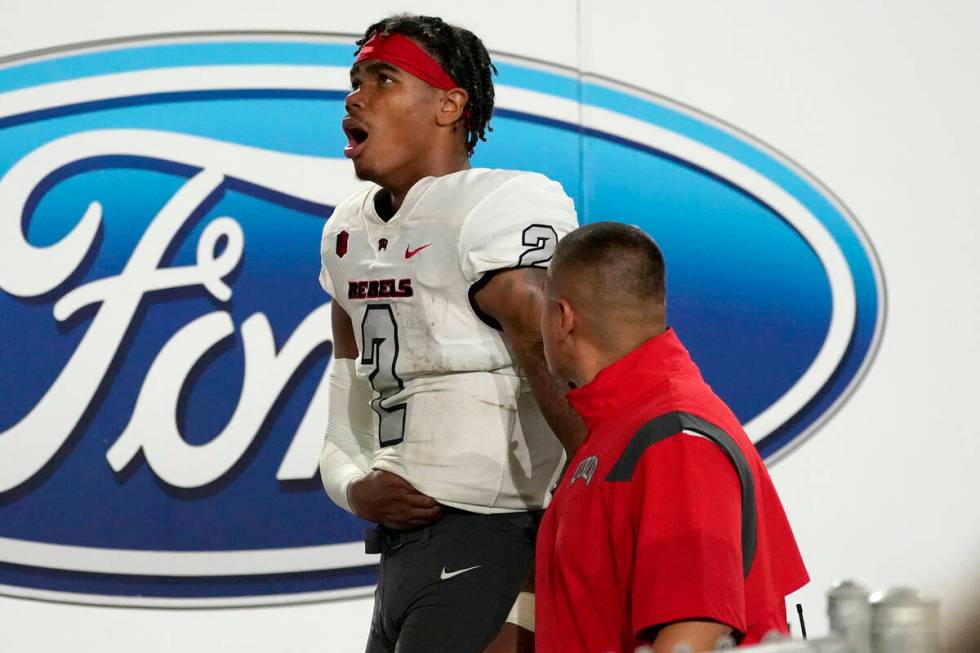 UNLV quarterback Doug Brumfield (2) leaves the game during the second half of an NCAA college f ...