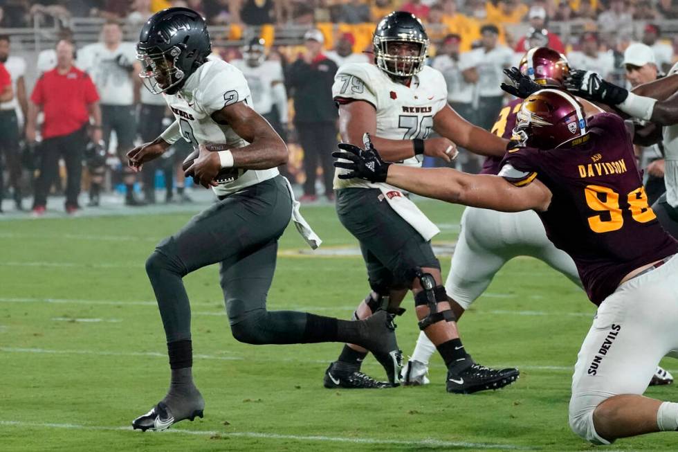 UNLV quarterback Doug Brumfield (2) runs for a touchdown against Arizona State during the first ...