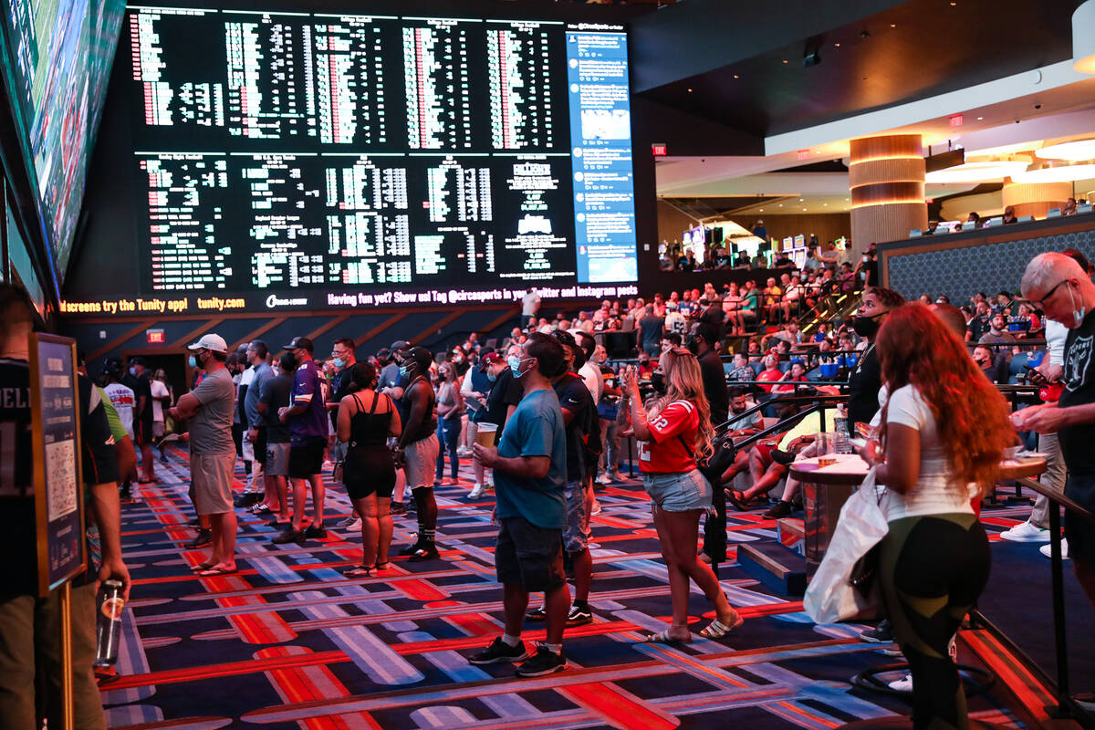 Guests watch the game as they wait to place their bets at the Sportsbook at Circa in Las Vegas, ...
