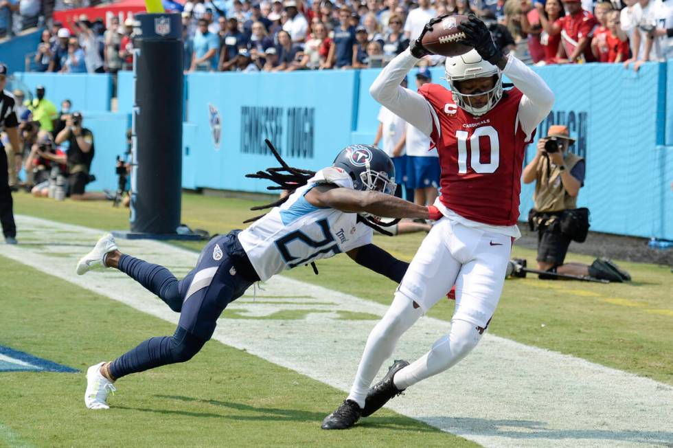 Arizona Cardinals wide receiver DeAndre Hopkins (10) catches a touchdown pass as he is defended ...