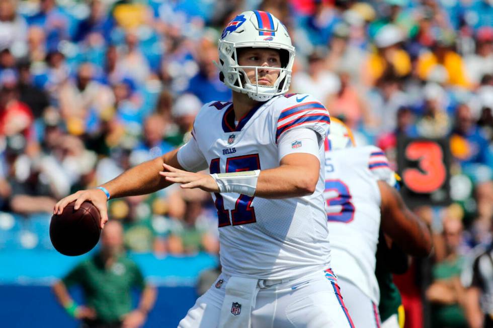 FILE - In this Saturday, Aug. 28, 2021, file photo, Buffalo Bills quarterback Josh Allen throws ...