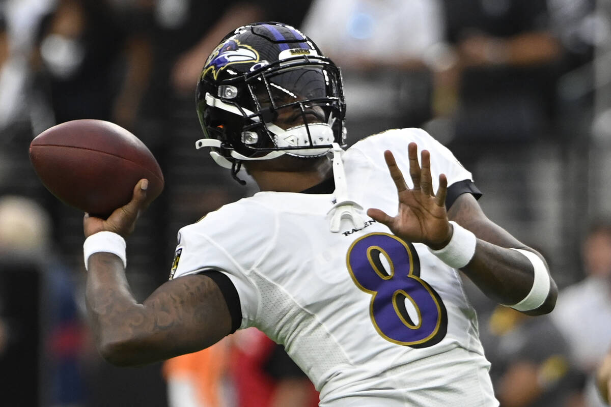 Baltimore Ravens quarterback Lamar Jackson (8) warms up before an NFL football game against the ...