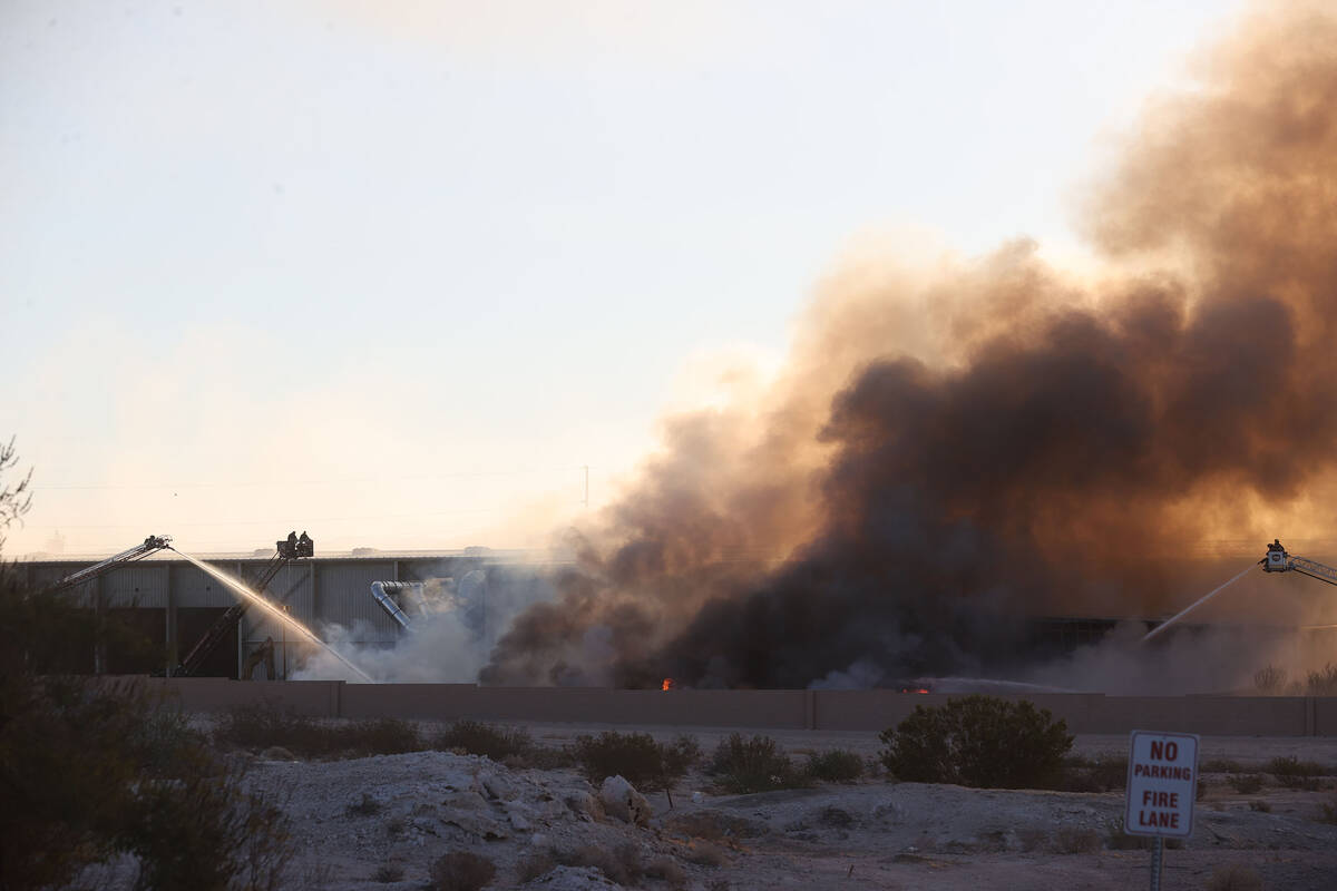 The North Las Vegas Fire Department battles a fire at a Republic Services recycling facility on ...