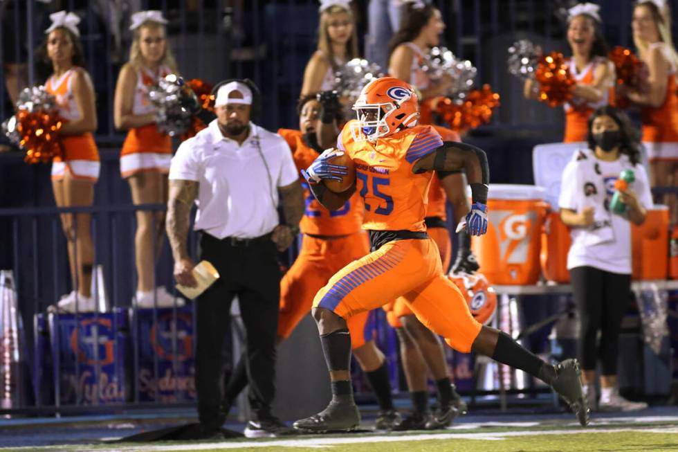 Bishop Gorman's William Stallings Jr. (25) runs the ball in the third quarter of a football gam ...