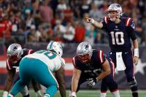 New England Patriots quarterback Mac Jones (10) during the second half of an NFL football game, ...