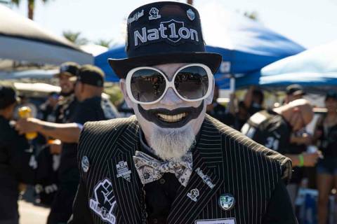 Joker Raider tailgates before an NFL football game between the Raiders and Baltimore Ravens at ...