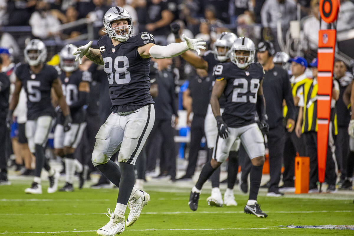 Raiders defensive end Maxx Crosby (98) celebrates a defensive stoppage during the third quarter ...