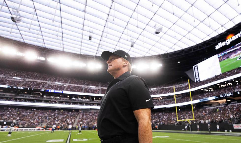 Raiders head coach Jon Gruden takes the field during warm ups before the start of an NFL footba ...