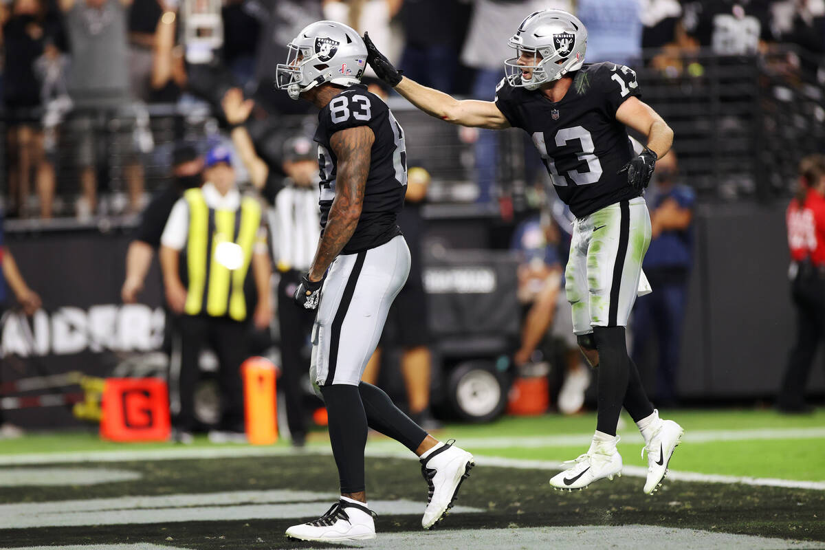 Raiders tight end Darren Waller (83) celebrates his touchdown with wide receiver Hunter Renfrow ...