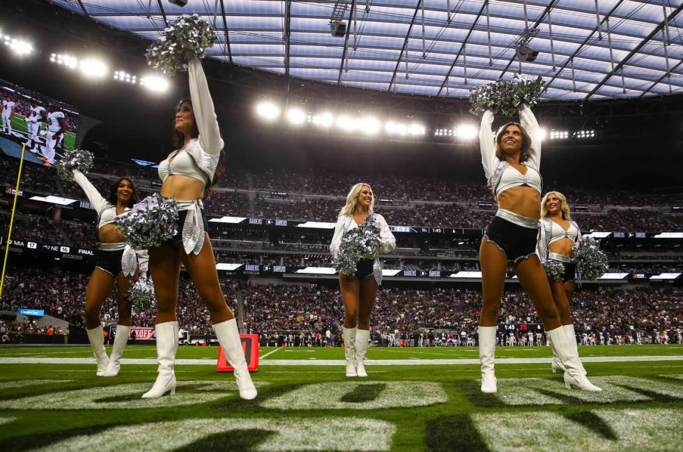 The Raiderettes perform before the start of an NFL game between the Raiders and Baltimore Raven ...