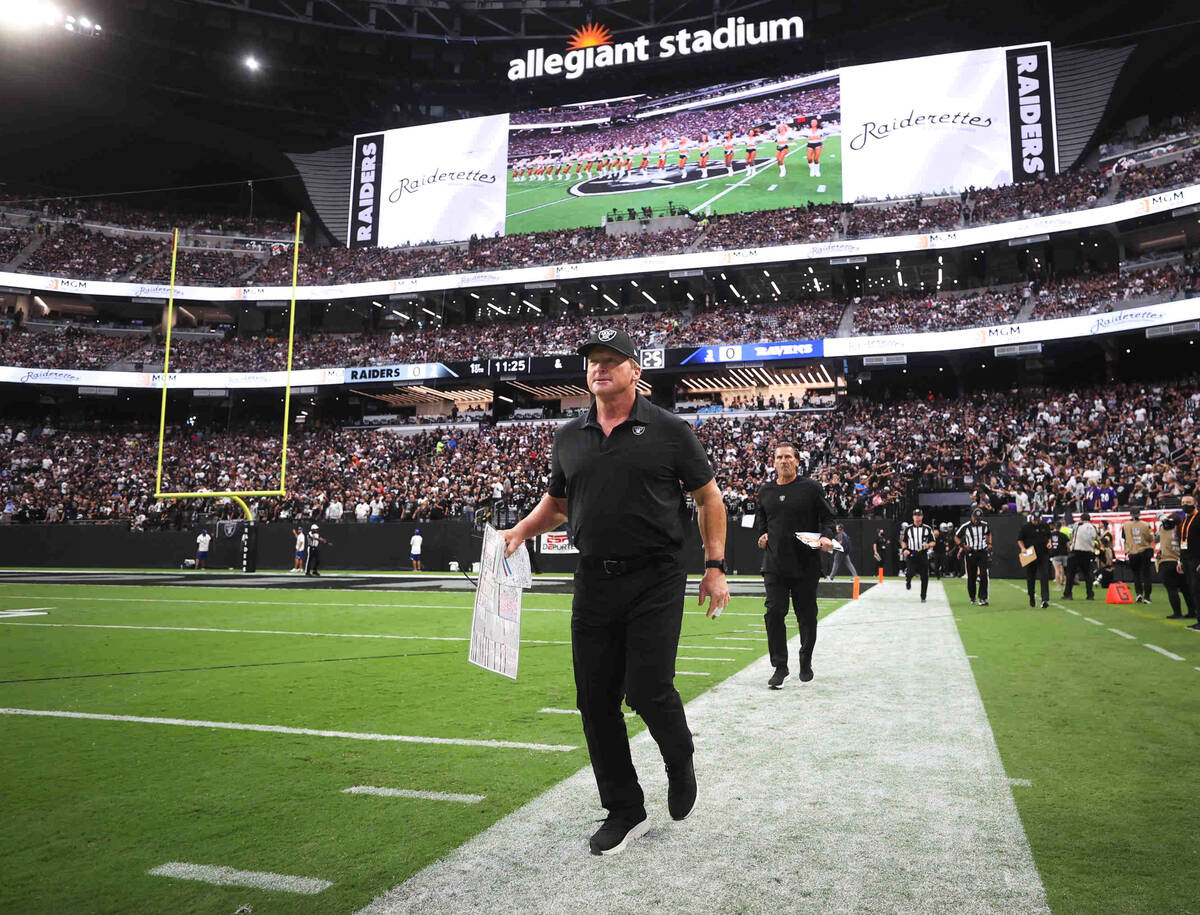 Raiders head coach Jon Gruden takes the field before an NFL football game between the Raiders a ...