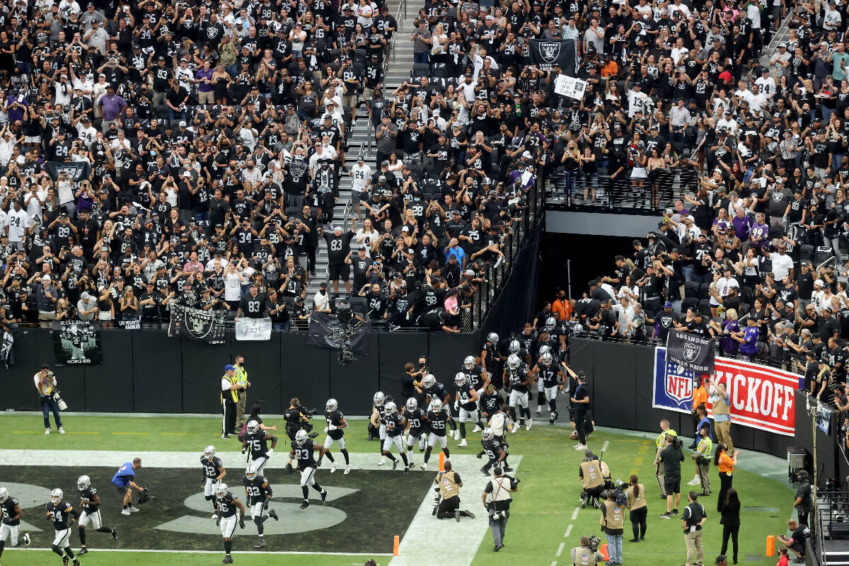 Fans cheer as the Raiders take the field to host the Baltimore Ravens on ÒMonday Night Footbal ...