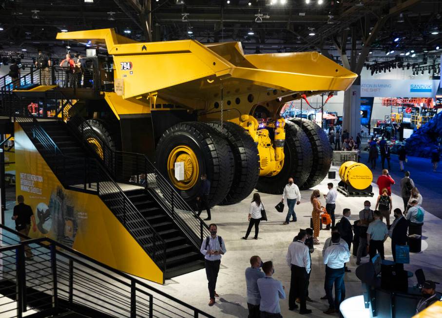 CAT 794 AC mining truck is displayed at Caterpillar booth during the opening day of the Nationa ...