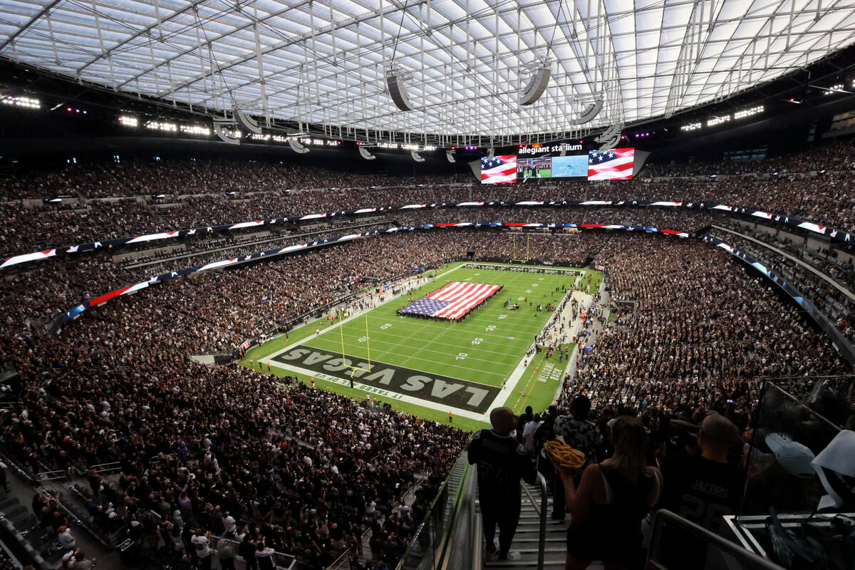 Fans stand for the National Anthem before the Raiders take on the Baltimore Ravens on "Monday N ...
