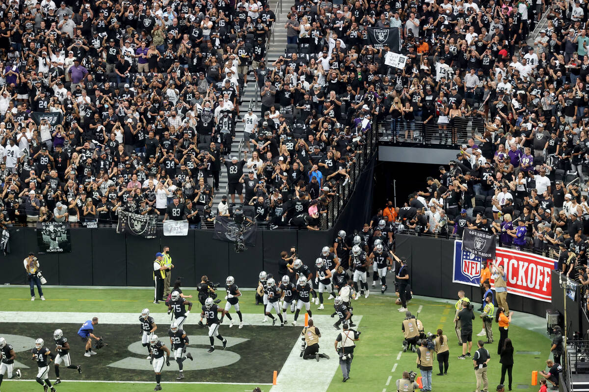 Fans cheer as the Raiders take the field to host the Baltimore Ravens on "Monday Night Football ...