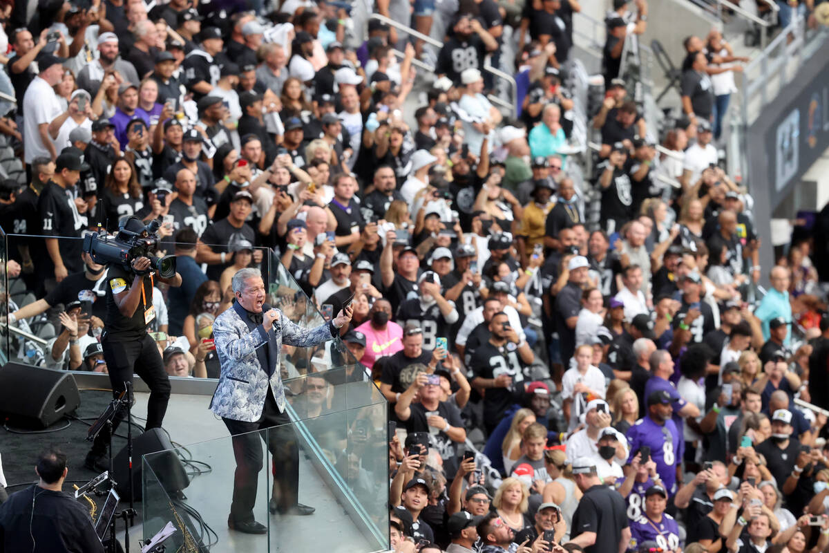 Fans cheer as Bruce Buffer introduces the Raiders the Baltimore Ravens on "Monday Night Footbal ...