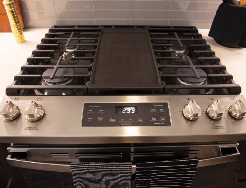 Stainless steel range is shown in a one-bedroom apartment at Auric Symphony Park, the first lux ...