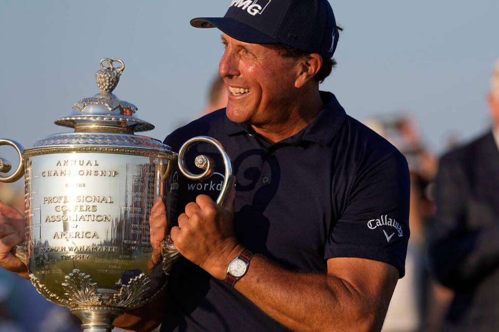Phil Mickelson holds the Wanamaker Trophy after winning the final round at the PGA Championship ...