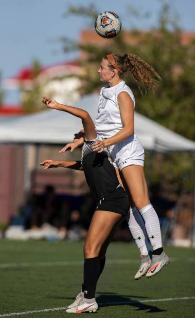 Arbor View’s Brynn Covington (20) and Faith Lutheran’s Aurrianna Parker (21) figh ...