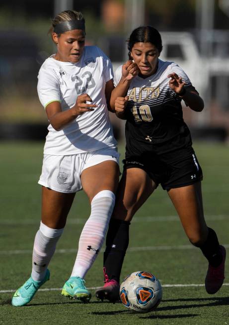 Arbor View’s Tiana Beavers (23) and Faith Lutheran’s Andrea Leyva (10) fight for ...