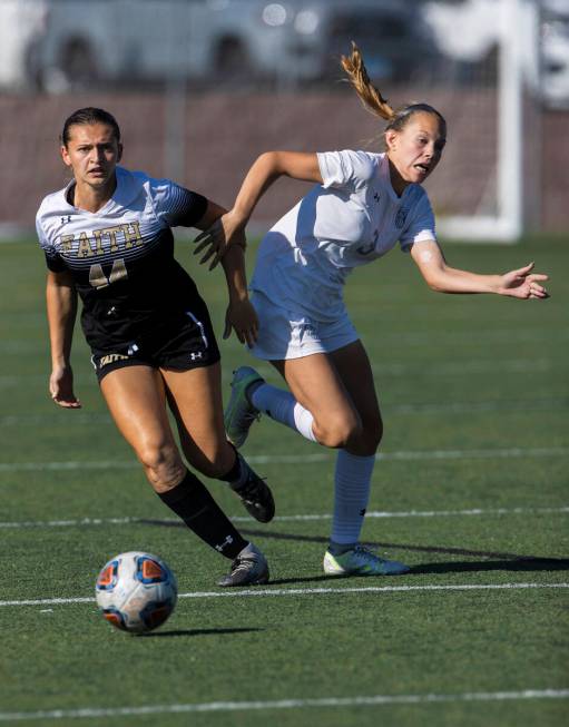 Arbor View’s Zoey Christian (3) and Faith Lutheran’s Ariana Gaminara (44) fight f ...